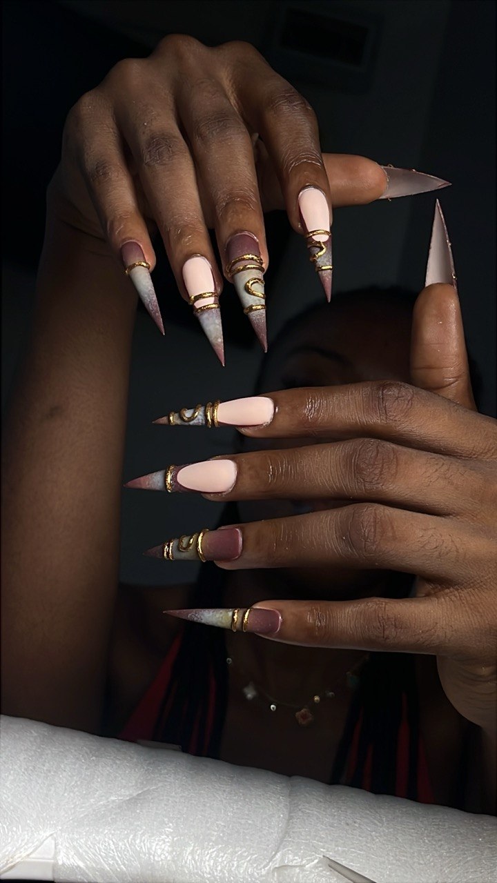 Nail art by Zoba Beauty β mauve and gold ringed stiletto set